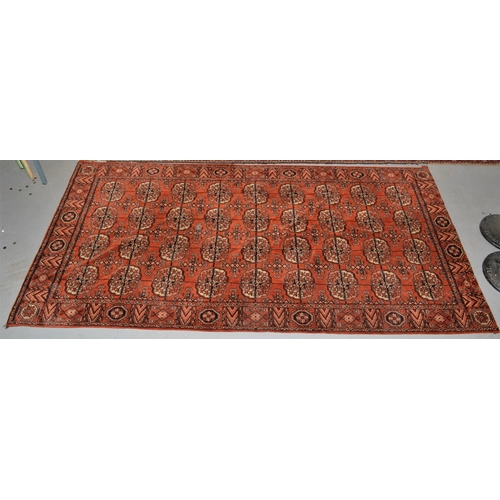 84 - Vintage red ground rug approx 8' x 4'6