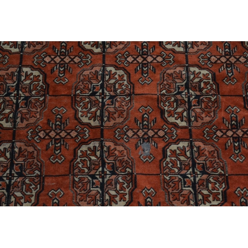 84 - Vintage red ground rug approx 8' x 4'6