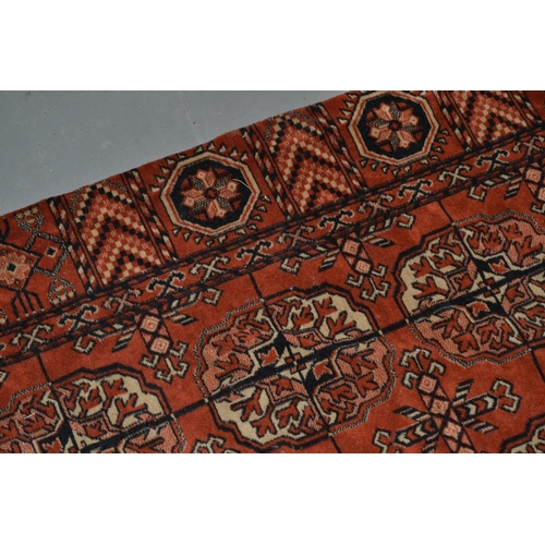 84 - Vintage red ground rug approx 8' x 4'6