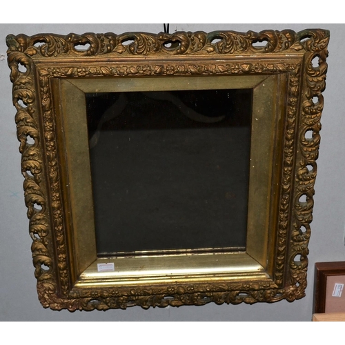 264 - An antique carved gilt wood wall mirror