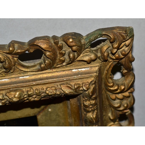 264 - An antique carved gilt wood wall mirror