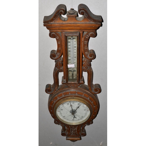 283 - An early 20th century carved wall barometer by Benetfink of London