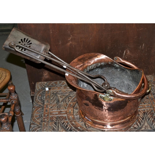 297 - A Victorian Copper coal bucket and a set of fire irons