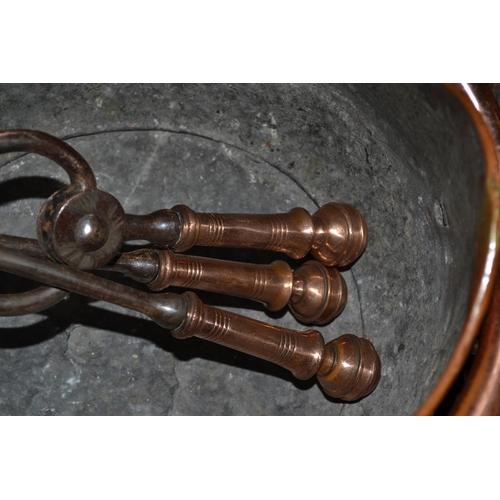 297 - A Victorian Copper coal bucket and a set of fire irons