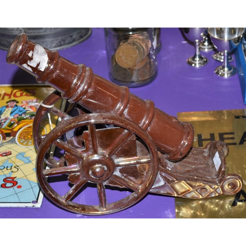 343 - A vintage cast iron and enamel cannon model