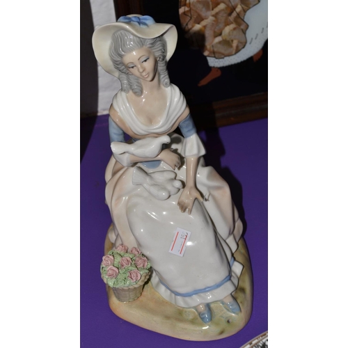 390 - A Spanish made Lladro style figure of a woman