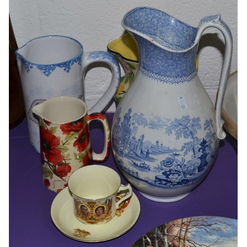 443 - A collection of pottery jugs and a Royal commemorative tea cup and saucer