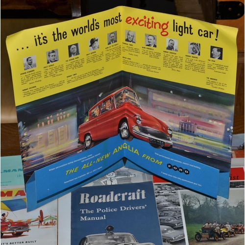 544 - A quantity of motoring related ephemera to include a Ford Anglia advertising display