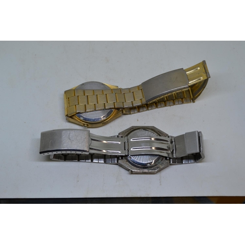 593 - A pair of 1970's LED watches