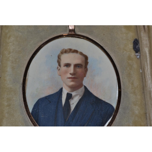 598 - Hand coloured miniature photograph in a leather folding case