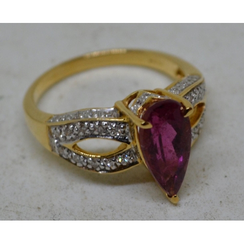 633 - 18ct gold diamond and rubellite ring - size O - Boxed with papers