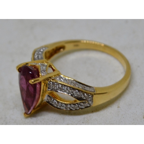 633 - 18ct gold diamond and rubellite ring - size O - Boxed with papers