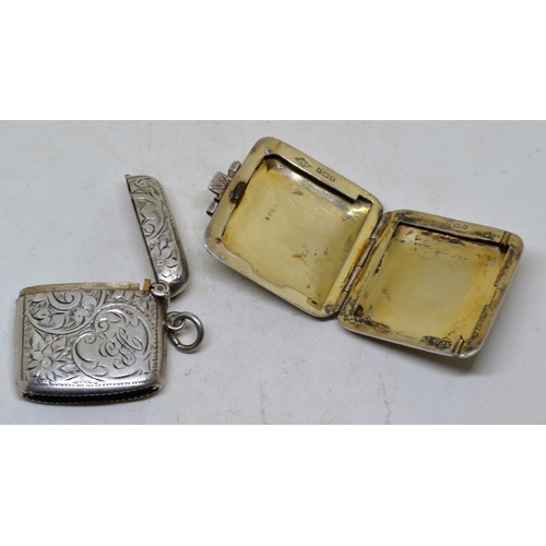 669 - Silver Vesta case and a Silver stamp box formed as an Art Deco period suitcase