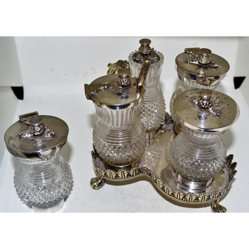 719 - An antique silver plate and cut glass cruet set formed as Scottish thistles - marked S Smith