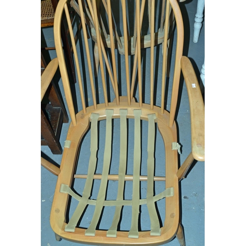 118 - Vintage Ercol armchair with orange cushions