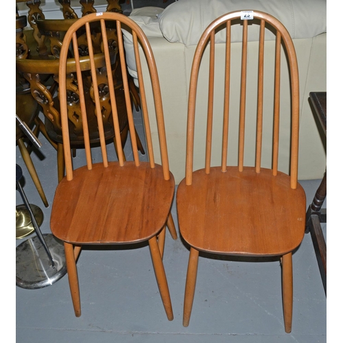 23 - A pair of retro Ercol style hoop backed dining chairs