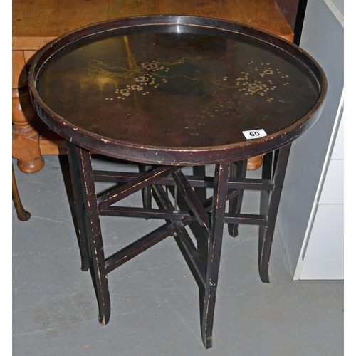 60 - An early 20th century black lacquer tray table and stand