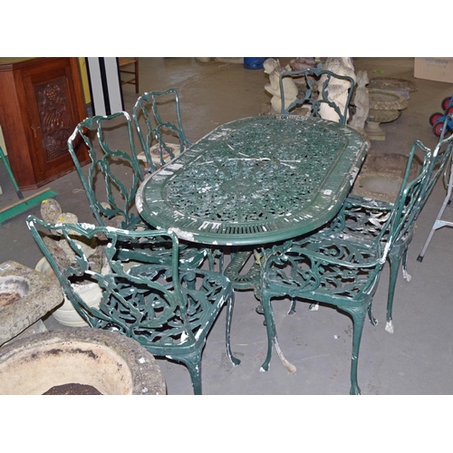 175 - A green painted Aluminium garden table and 6 chairs