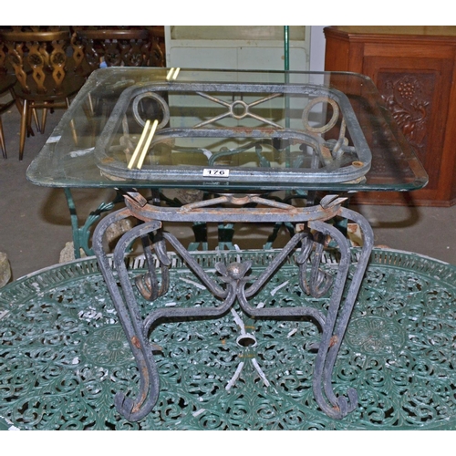 176 - A metal based garden table with glass top