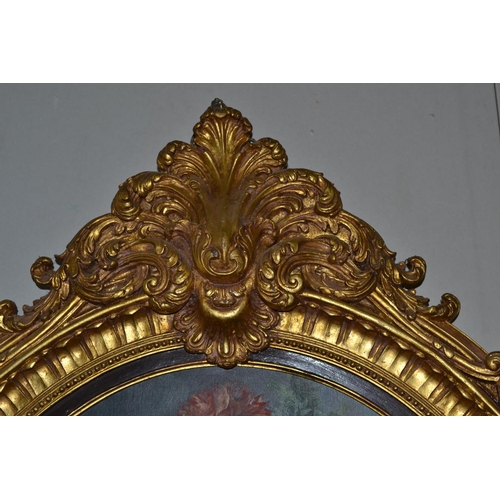 221 - An enormous gilt framed oil on board of a still life in a highly decorative oval gilt frame