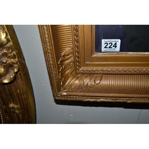 224 - An antique gilt framed mirror