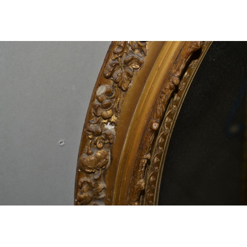 227 - A pair of antique gilt framed oval mirrors