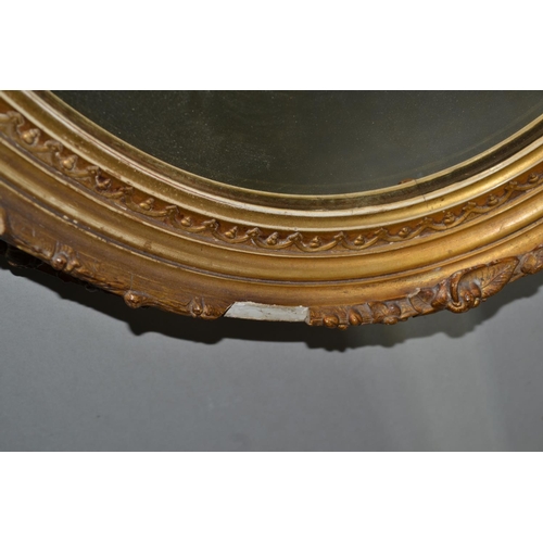 227 - A pair of antique gilt framed oval mirrors