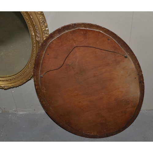 227 - A pair of antique gilt framed oval mirrors