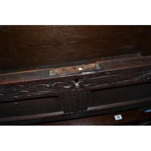 29 - An 18th/19th century small carved Oak coffer