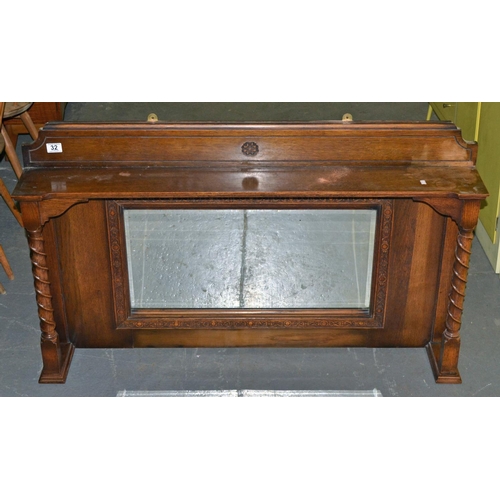 32 - A 1930's carved oak over mantle mirror with barleytwist supports