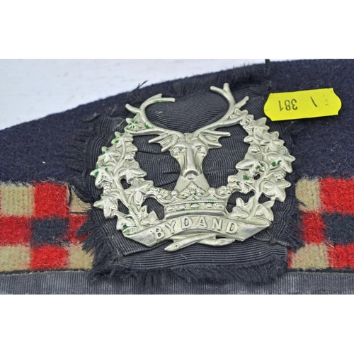 323 - A Gordon Highlanders Glengarry cap and a Cameron Highlanders Balmoral