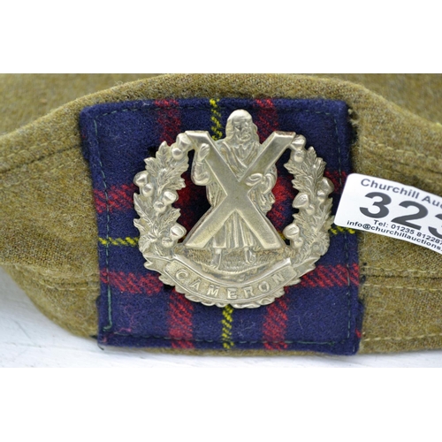 323 - A Gordon Highlanders Glengarry cap and a Cameron Highlanders Balmoral