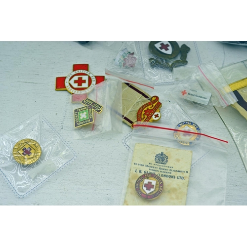 329 - Qty of Red Cross insignia and badges including medals