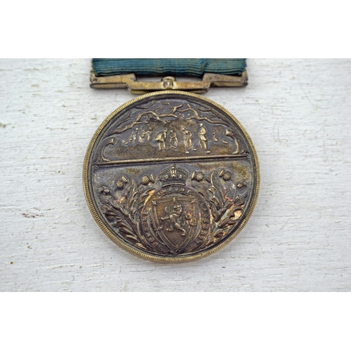 330 - Royal Caledonia Curling Club medal - Birmingham 1935 by J.A Restall & Co