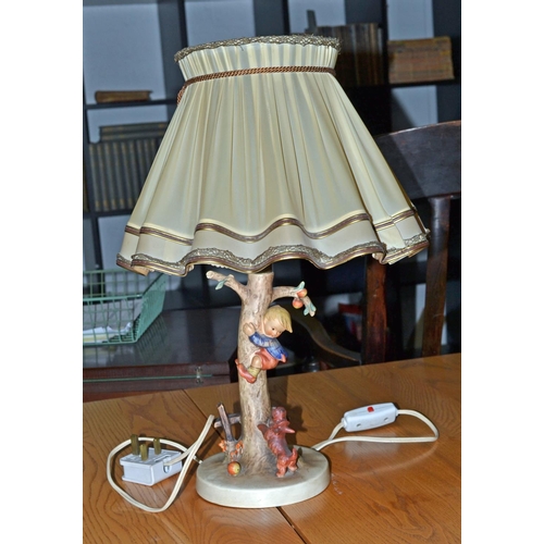 53 - A Hummel by Goebel lamp depicting a boy being chased up a tree by a dog with period shade