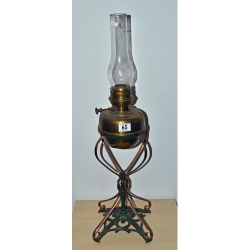 65 - An Art Nouveau period brass and iron oil lamp likely by WAS Benson but certainly in that style c.190... 