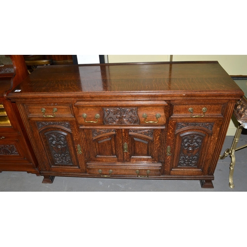 86 - A large early 20th century carved oak sideboard