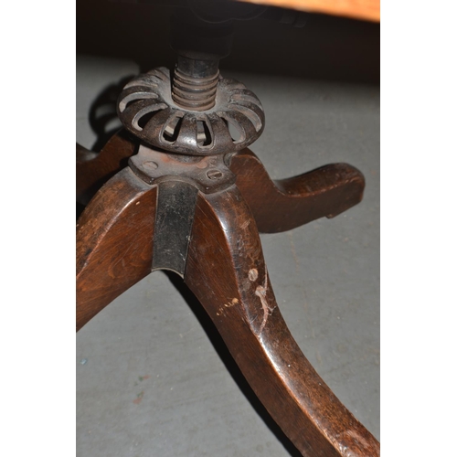 96 - An early 20th century wooden office swivel chair with metal fittings