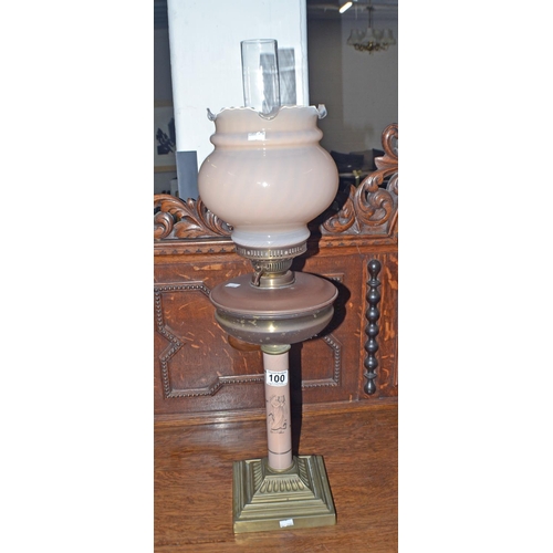 100 - An unusual antique oil lamp with Roman design and glass shade