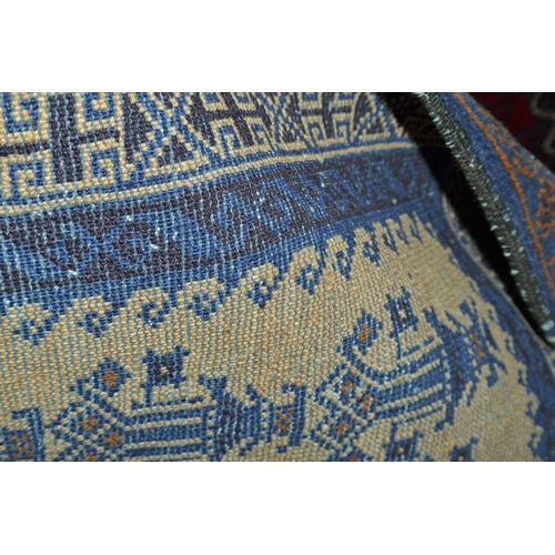 131 - A vintage blue and cream ground rug