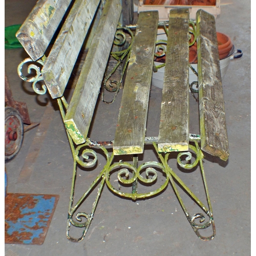 149 - An antique painted wrought iron garden bench