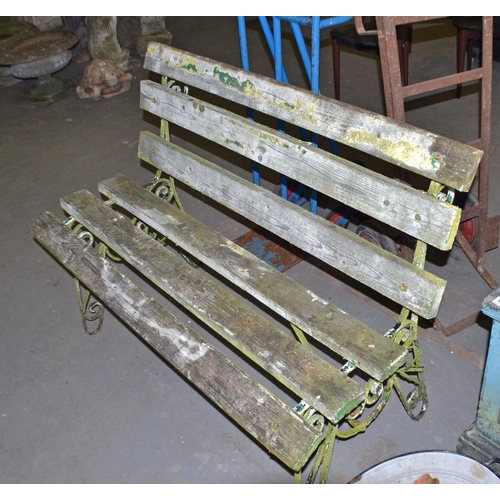 149 - An antique painted wrought iron garden bench