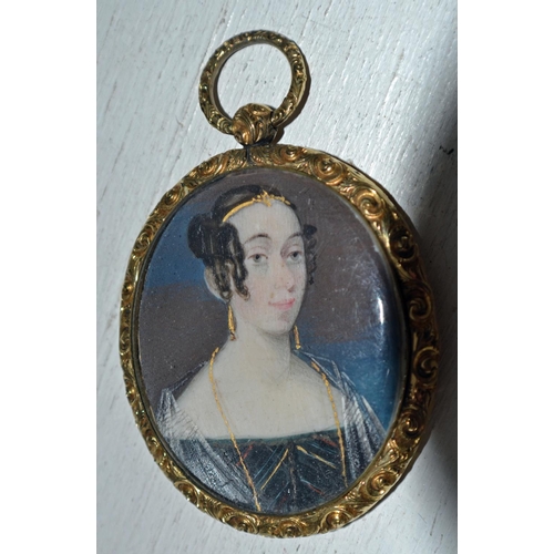 283 - A miniature watercolour miniature on ivory of a young lady set within a yellow metal frame - comes c... 