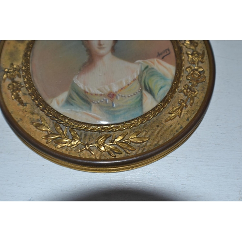 284 - A gilt framed miniature of a Regency lady signed Auvry with details verso - likely 19th century