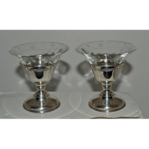 637 - A pair of Canadian silver Sherbets or Champagne glasses with silver stems and engraved glass inserts... 