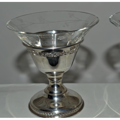 637 - A pair of Canadian silver Sherbets or Champagne glasses with silver stems and engraved glass inserts... 