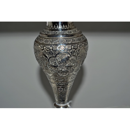 648 - An Arabic/ Indian white metal vase of bulbous form with highly embossed design c.1900