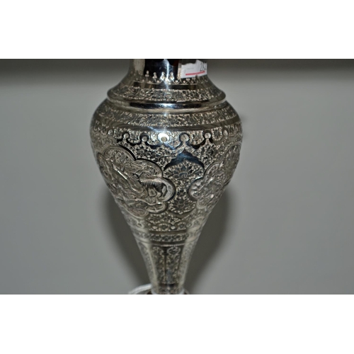 648 - An Arabic/ Indian white metal vase of bulbous form with highly embossed design c.1900