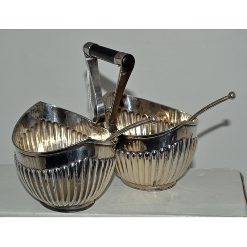 652 - A Silver double sugar bowl with ebonised wooden handle in the style of Christopher Dresser with 2 or... 