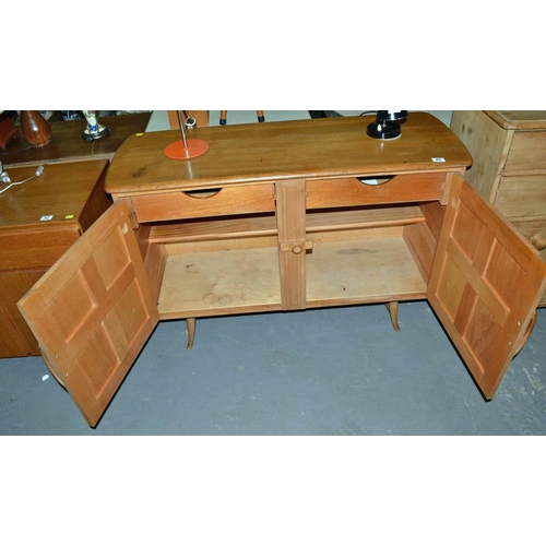 49 - An unusual vintage Blonde Ercol sideboard on splayed feet